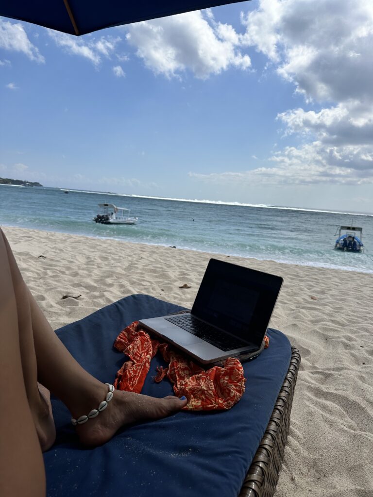 Female travel agent by the beach